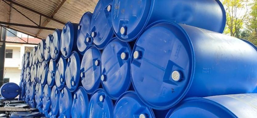 Bitumen emulsion drums stacked under cover at the godown